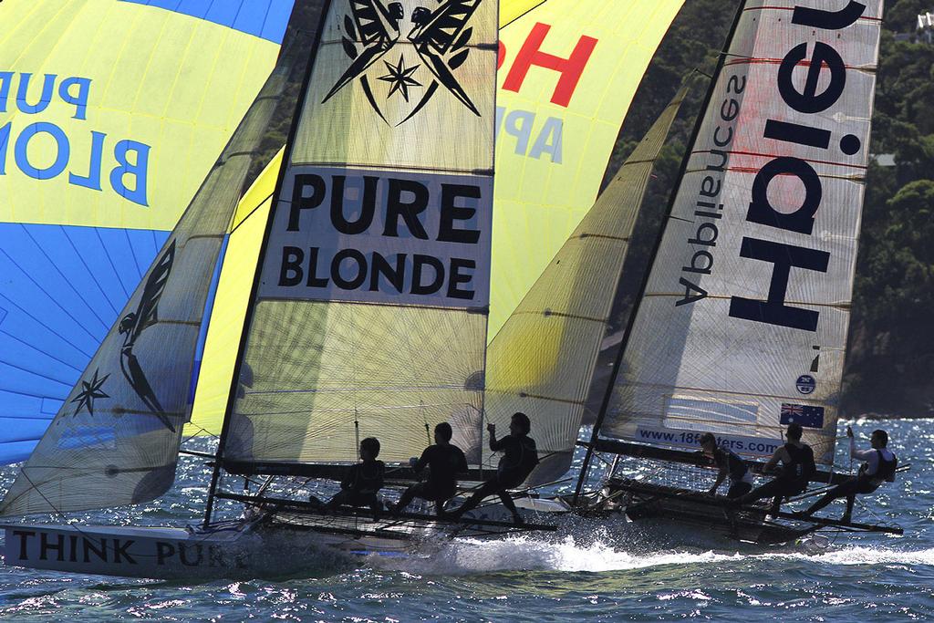 Pure Blonde sails over the top of Haier Appliances on the middle run to the Clarke Island mark - Australian 18 Footers, League, Syd. Barnett Memorial Trophy,  Sunday, 14 December 2014, Sydney Harbour. © Australian 18 Footers League http://www.18footers.com.au